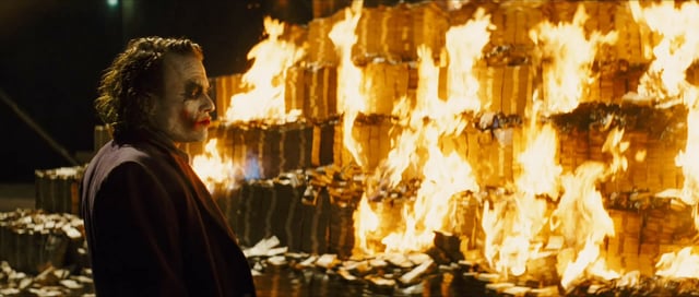 the joker burning money