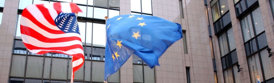 American and European Union flags flying