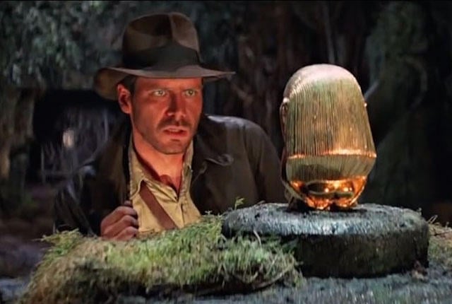 Indiana Jones looking at the Chachapoyan Fertility Idol in 'Raiders of the Lost Ark'