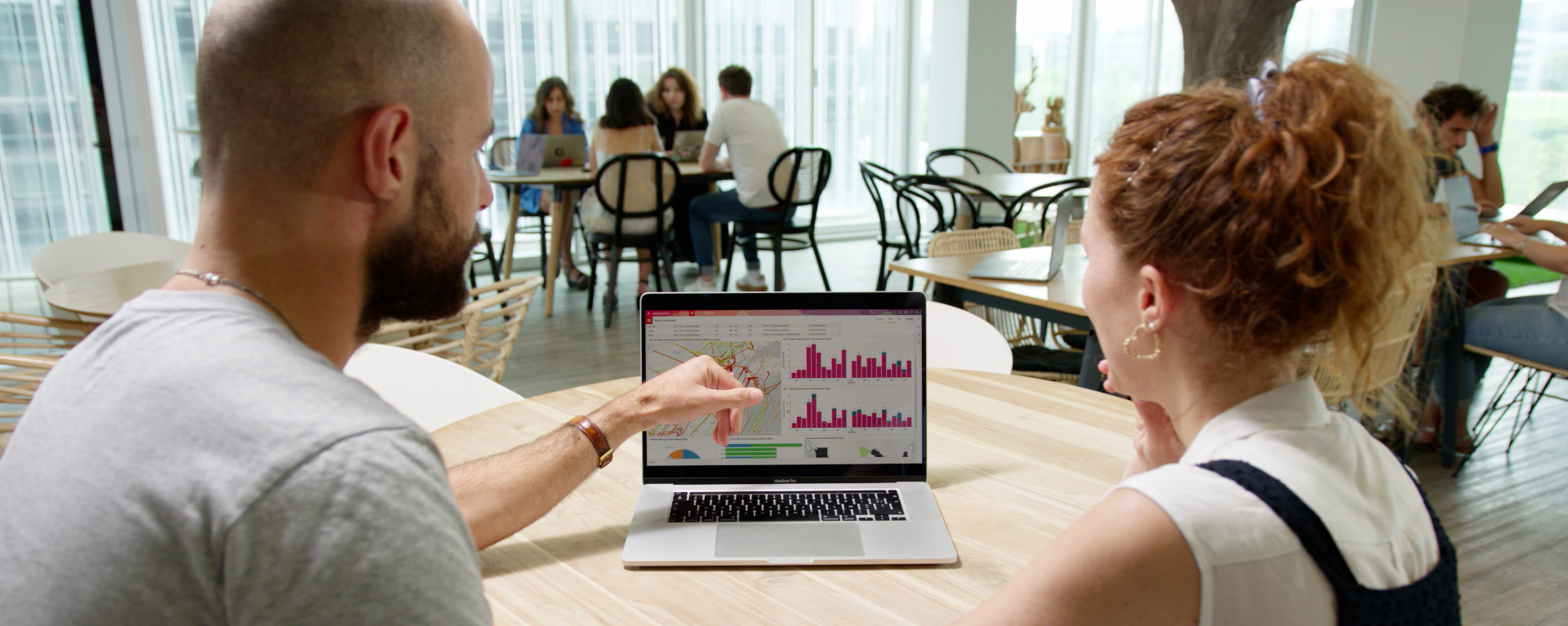 two colleagues working together at a table