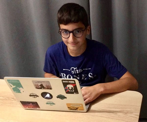 Cyprien working on a computer