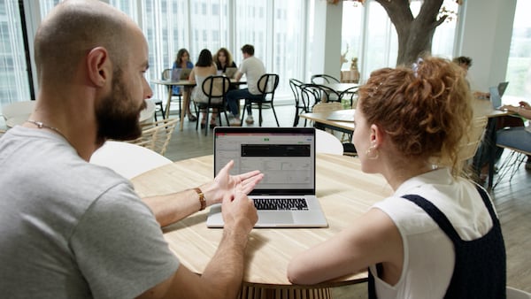 people looking at Dataiku on a screen