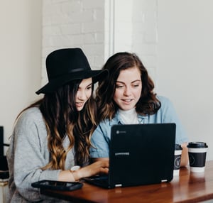 tech creativity two girls at a desk