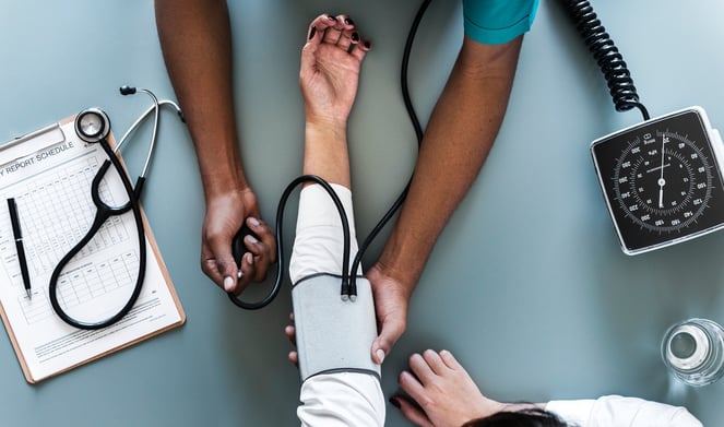 doctor doing arm check up on a patient