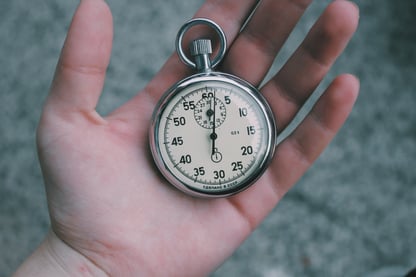 hand holding a clock