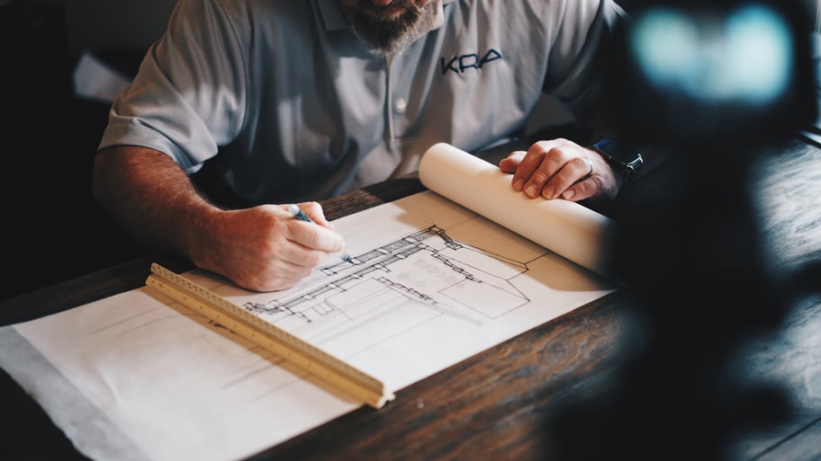 architect drawing a building plan