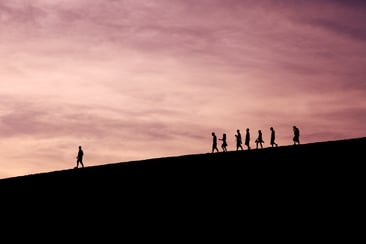 People walking in a line from far away