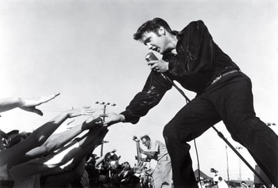Elvis singing into microphone