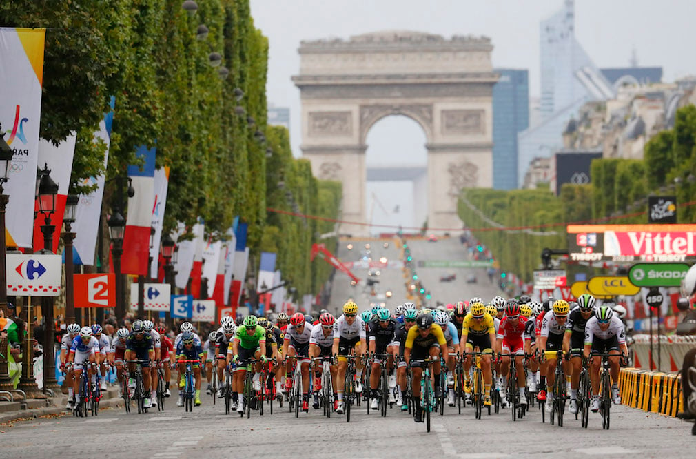 Tour de France contestants racing on the Champs Elysées