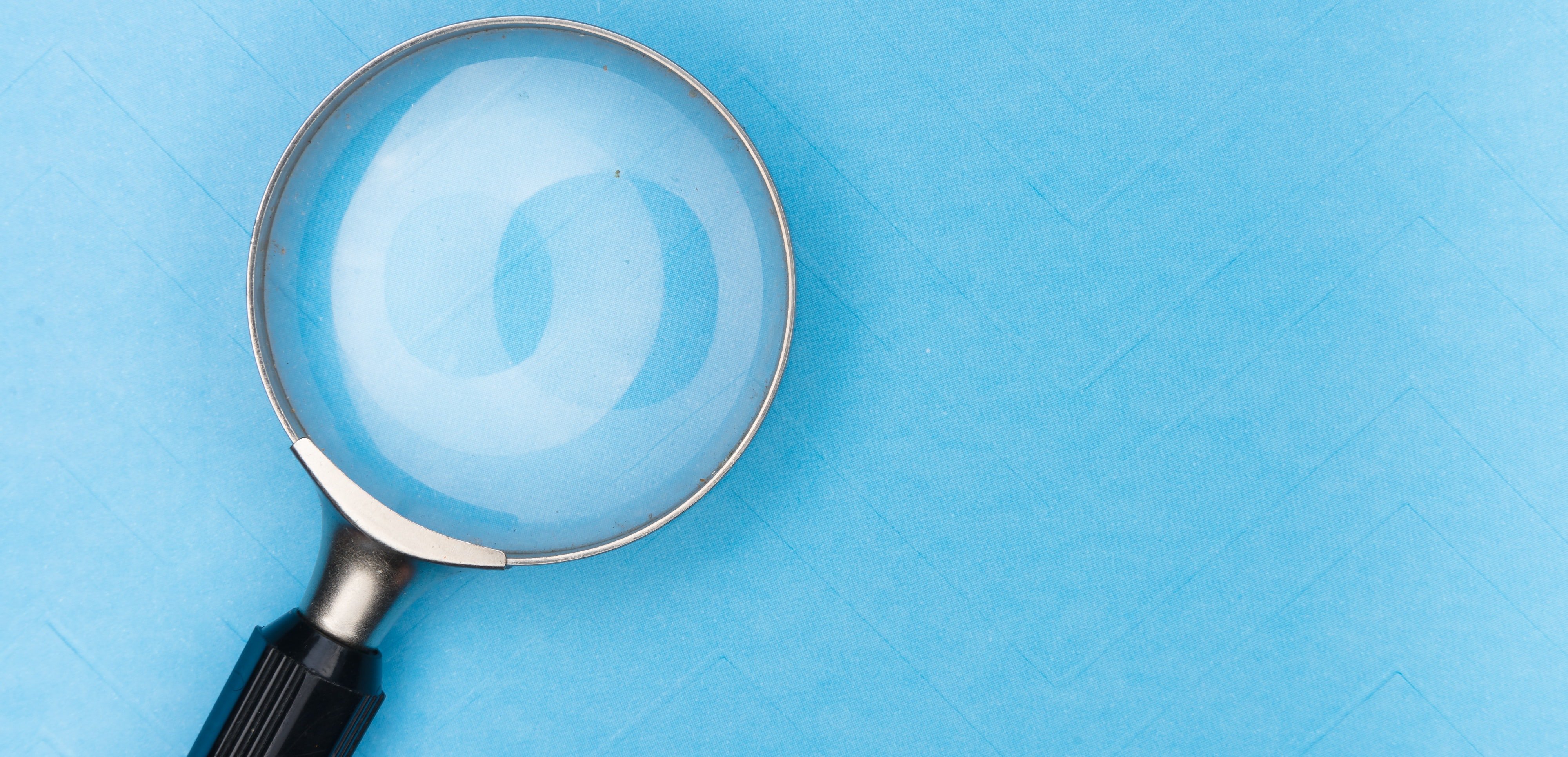 magnifying glass on blue background