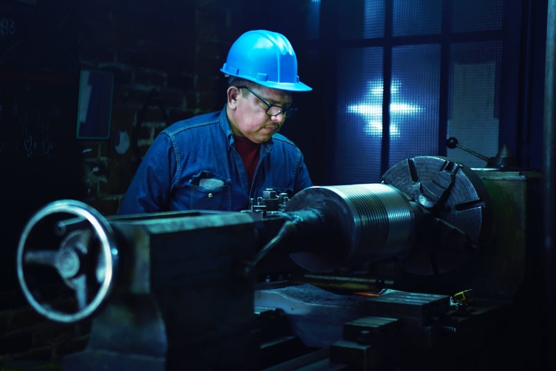 manufacturing worker with blue helmet