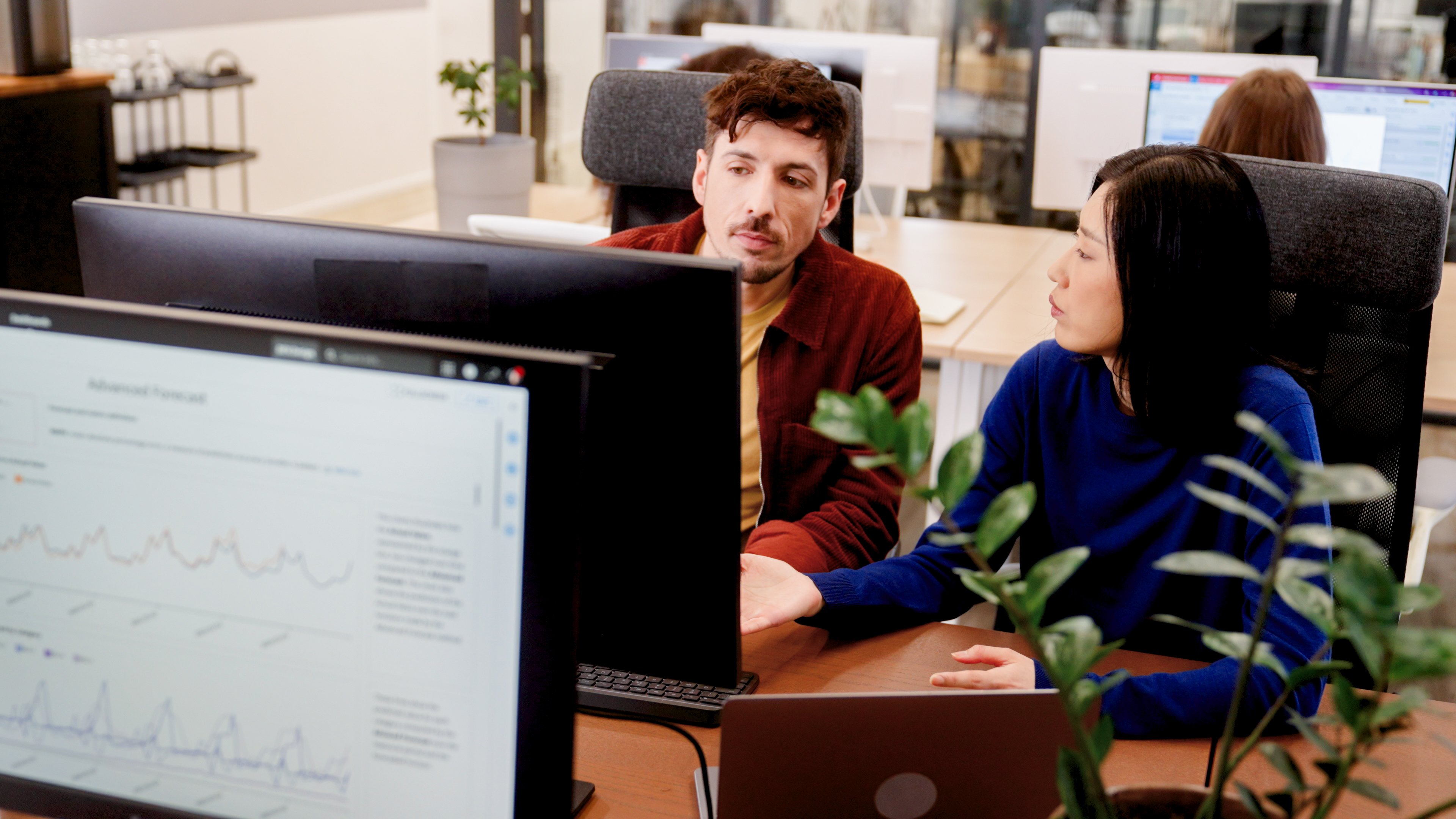 two people looking at a screen