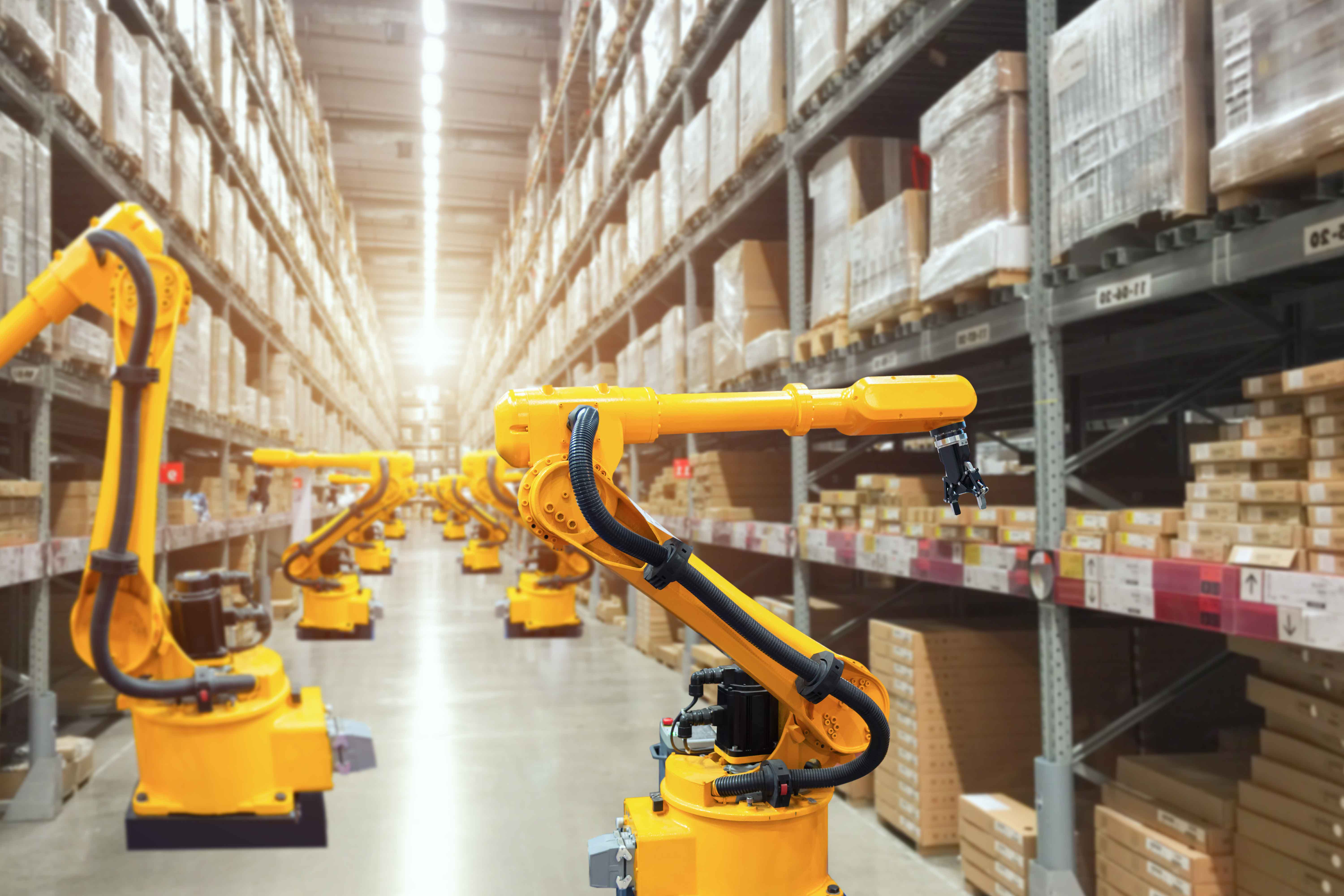 yellow machines in manufacturing warehouse
