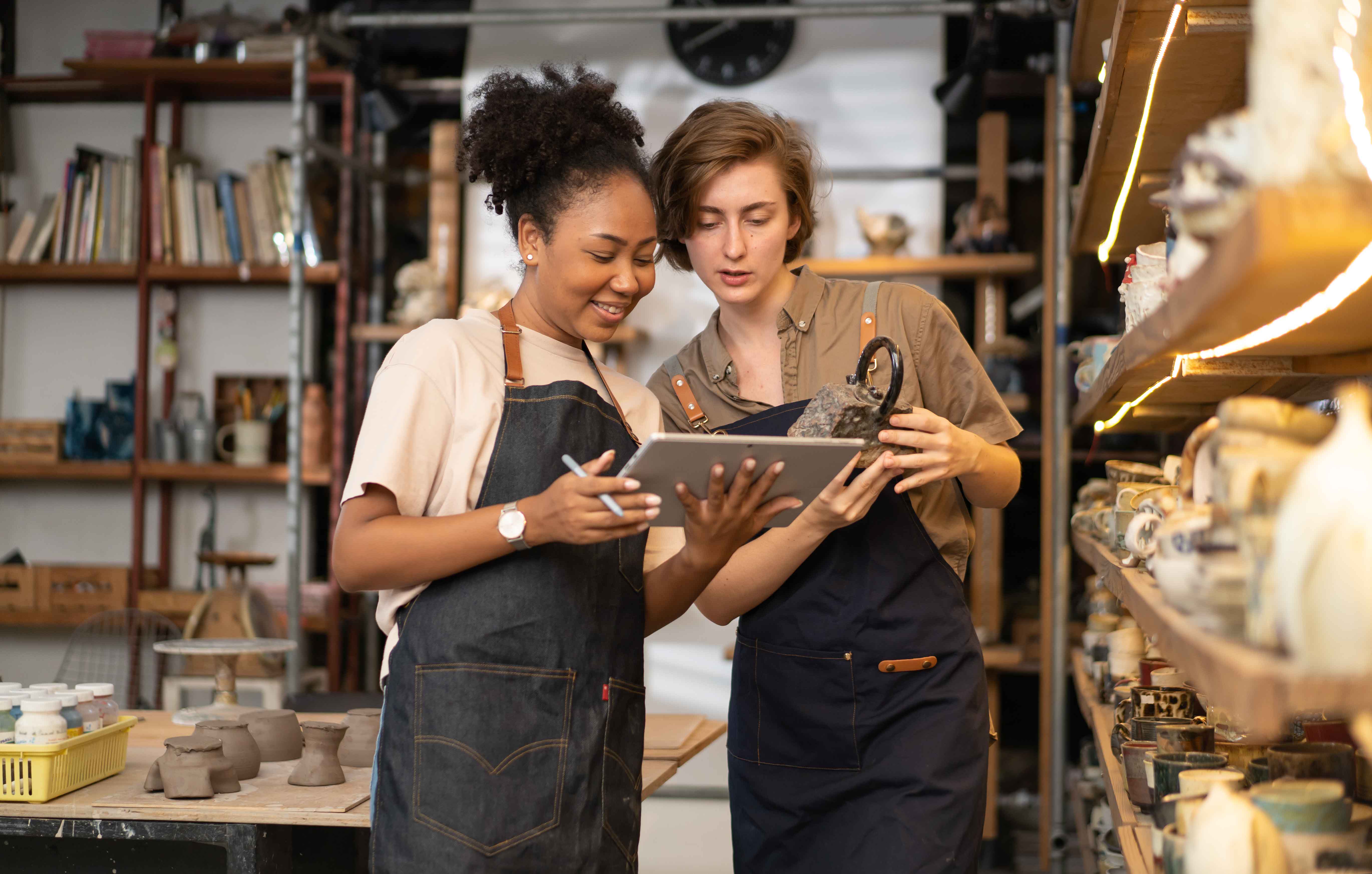 two women looking at an ipad